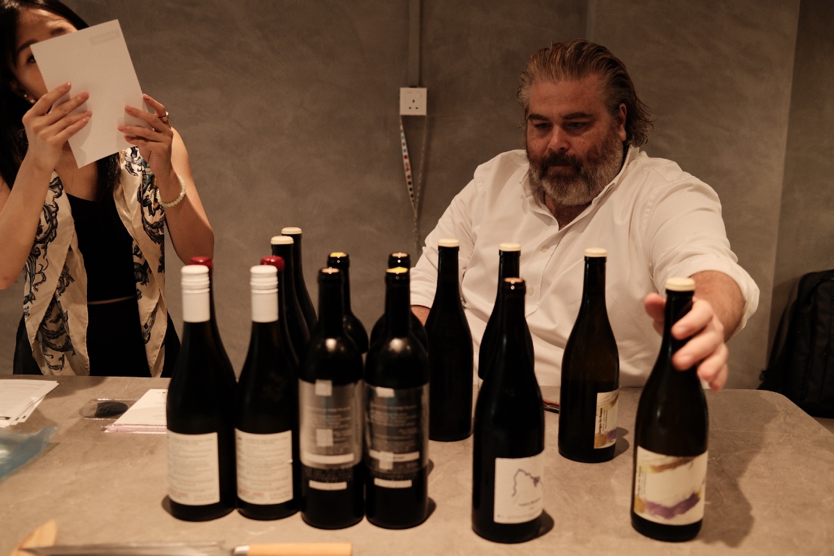Moritz Deyle, General Manager of Artisan Cellars, checking wines at a recent event he did with AWR. (Photo Credit: Jaclene Liew)